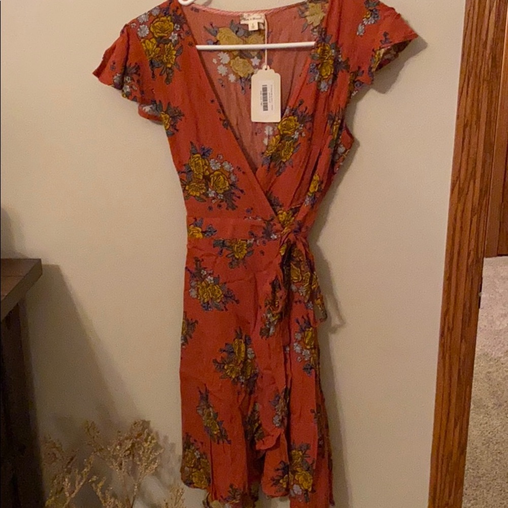 Burnt orange floral wrap dress. Never been worn